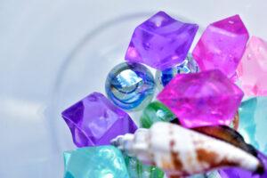 Colorful crystals and balls in a glass glass
